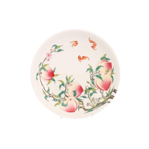 210 - A Chinese porcelain peach dish, painted on both sides with ripe peaches on leafy branches with bats,... 