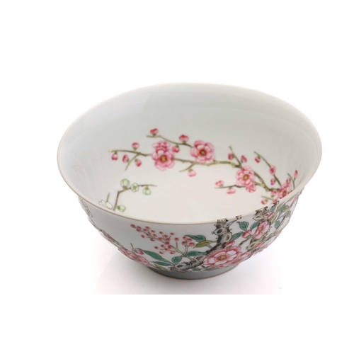 212 - A Chinese porcelain prunus blossom bowl, painted with pink and white flowers on gnarled branches, a ... 