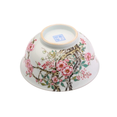 212 - A Chinese porcelain prunus blossom bowl, painted with pink and white flowers on gnarled branches, a ... 