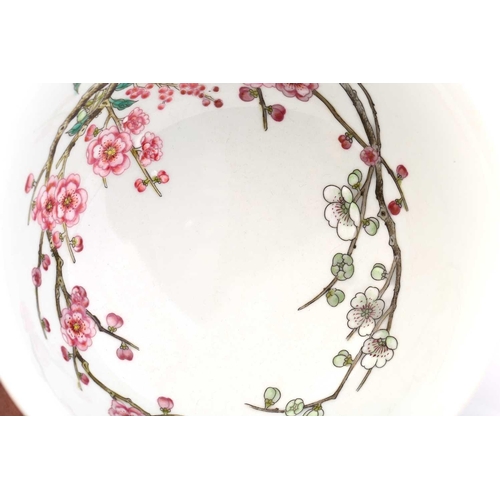 212 - A Chinese porcelain prunus blossom bowl, painted with pink and white flowers on gnarled branches, a ... 