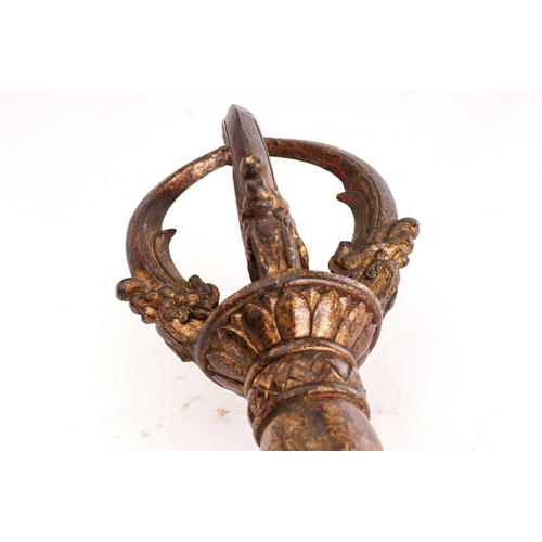 213 - A Chinese Sino Tibetan bronze Kartika, the finial formed of four uniting masks and tongues, a dragon... 