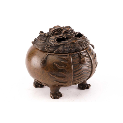 214 - A Chinese bronze censor, modelled as a round and squat Pixiu, the head forming the cover with scroll... 