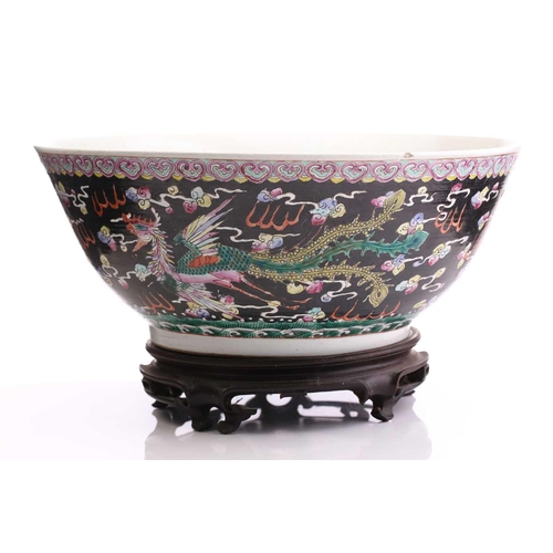 216 - A large Chinese porcelain bowl, early 20th century, the interior painted with lotus flowers, pods an... 