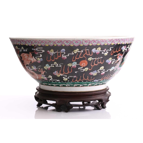 216 - A large Chinese porcelain bowl, early 20th century, the interior painted with lotus flowers, pods an... 