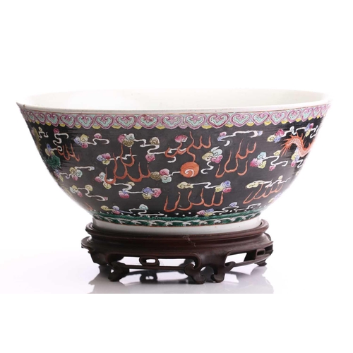 216 - A large Chinese porcelain bowl, early 20th century, the interior painted with lotus flowers, pods an... 