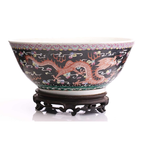 216 - A large Chinese porcelain bowl, early 20th century, the interior painted with lotus flowers, pods an... 