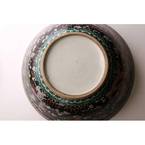 216 - A large Chinese porcelain bowl, early 20th century, the interior painted with lotus flowers, pods an... 