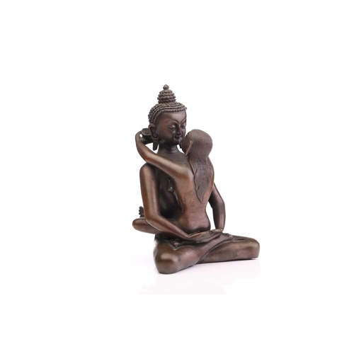 217 - A Tibetan bronze figure of the Buddha & Consort Samantabadra in a loving embrace, the base with a pr... 