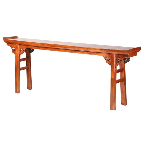 218 - A Chinese elm altar table with everted ends, scroll frieze and simple square supports. 229 cm wide x... 