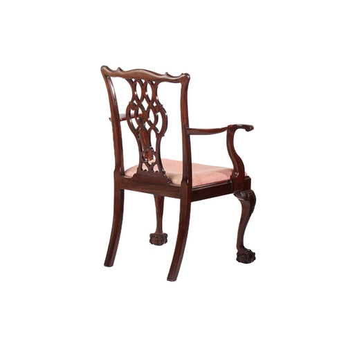 223 - A Chippendale-style mahogany ribbon back open armchair, early 20th century; with shaped and olive br... 