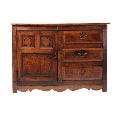 224 - An 18th century and later oak and elm dresser with a planked top above a bank of three short drawers... 