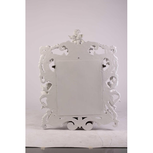 228 - An impressive white-painted and carved composition Baroque console table and wall mirror with a prof... 