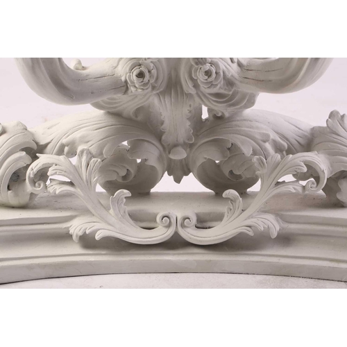 228 - An impressive white-painted and carved composition Baroque console table and wall mirror with a prof... 