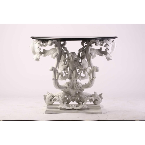 228 - An impressive white-painted and carved composition Baroque console table and wall mirror with a prof... 