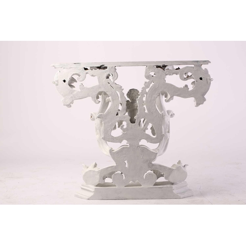 228 - An impressive white-painted and carved composition Baroque console table and wall mirror with a prof... 