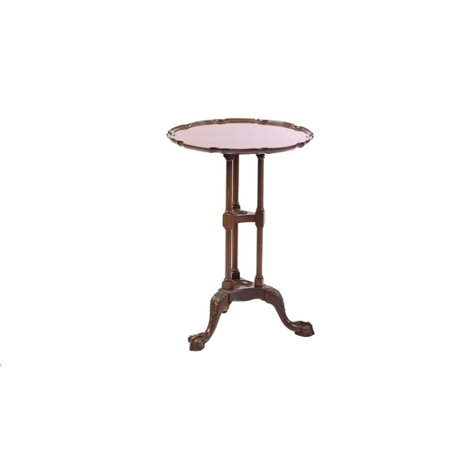 250 - A George III and later mahogany tripod table with a plain circular top and unusual 