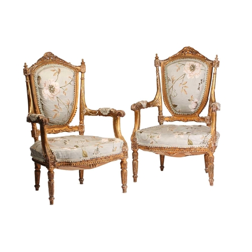 251 - A pair of Louis XVI-style carved wood and gilt gesso fauteuils a la Reine (armchairs) probably late ... 