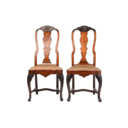 254 - A pair of late 18th century Dutch marquetry inlaid walnut side chairs with carved shell cresting rai... 