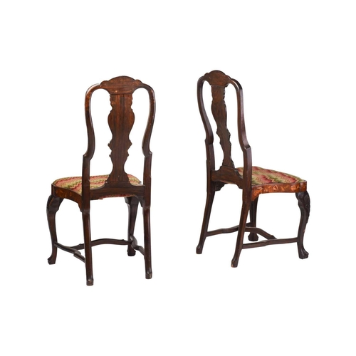 254 - A pair of late 18th century Dutch marquetry inlaid walnut side chairs with carved shell cresting rai... 