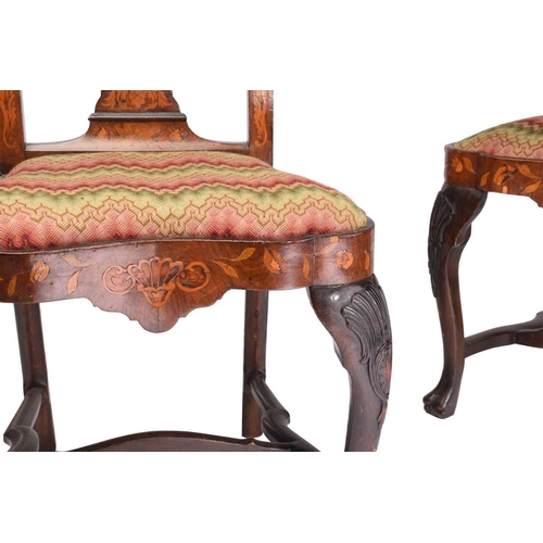 254 - A pair of late 18th century Dutch marquetry inlaid walnut side chairs with carved shell cresting rai... 