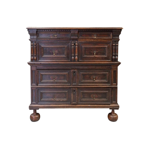 257 - A late 17th-century walnut and oak two-section four-drawer chest of drawers. with split bobbin appli... 