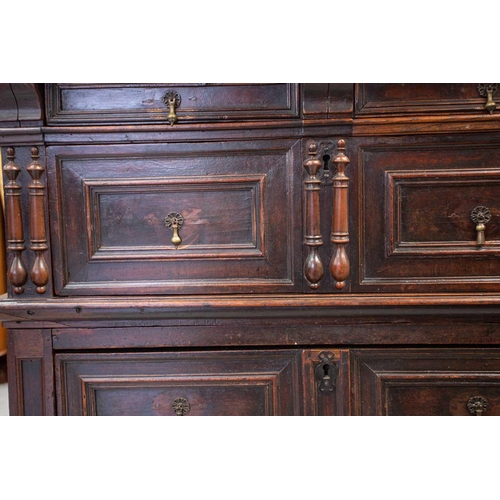 257 - A late 17th-century walnut and oak two-section four-drawer chest of drawers. with split bobbin appli... 