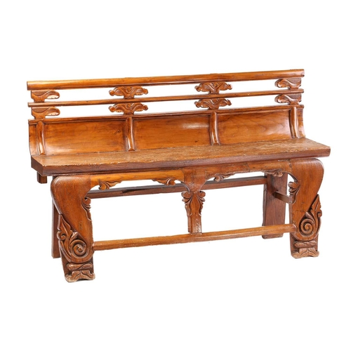 259 - A Chinese elm temple bench, probably late 19th century, with carved double rail back over a thick so... 