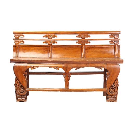 259 - A Chinese elm temple bench, probably late 19th century, with carved double rail back over a thick so... 