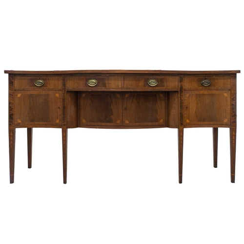 260 - A Friedman Brothers 1929; a George III style inlaid mahogany, serpentine kneehole sideboard with fou... 