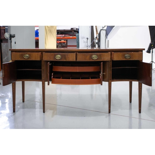 260 - A Friedman Brothers 1929; a George III style inlaid mahogany, serpentine kneehole sideboard with fou... 