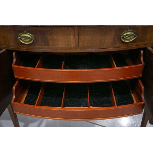 260 - A Friedman Brothers 1929; a George III style inlaid mahogany, serpentine kneehole sideboard with fou... 