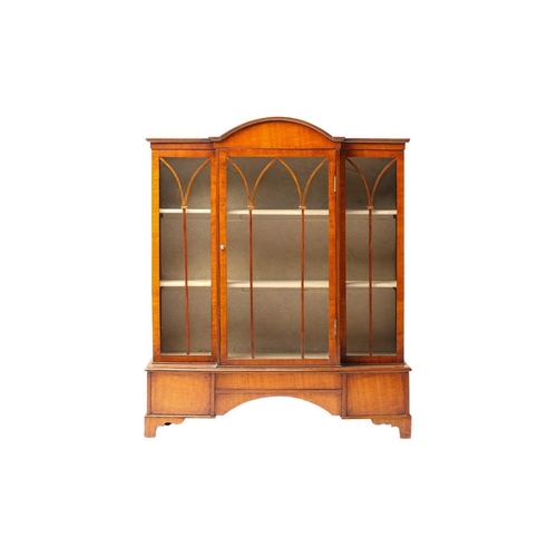 261 - An early 20th-century mahogany miniature single-door breakfront bookcase with a domed central sectio... 