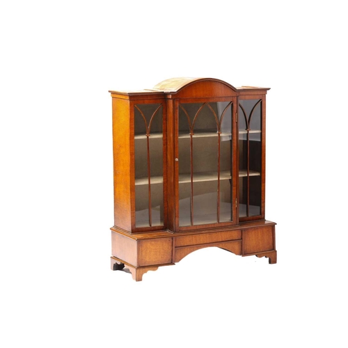 261 - An early 20th-century mahogany miniature single-door breakfront bookcase with a domed central sectio... 