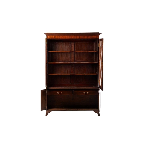 273 - George III mahogany bookcase, on a later stand, the protruding dentil cornice over a pair of astrgal... 