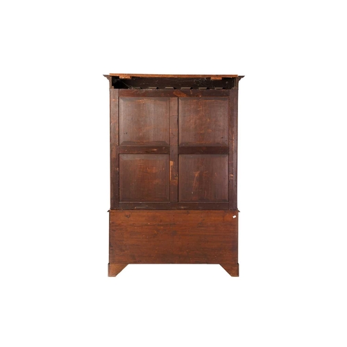 273 - George III mahogany bookcase, on a later stand, the protruding dentil cornice over a pair of astrgal... 