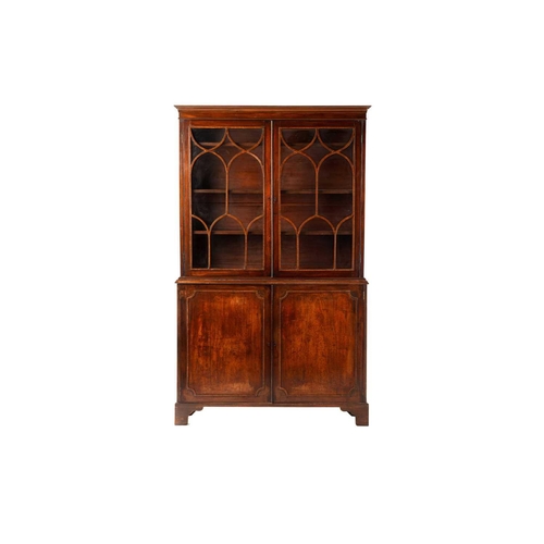 285 - A George III and later mahogany bookcase cabinet, the moulded cornice above a pair of glazed doors w... 