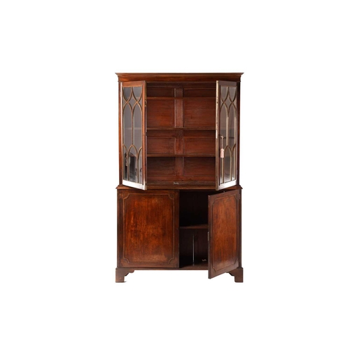 285 - A George III and later mahogany bookcase cabinet, the moulded cornice above a pair of glazed doors w... 