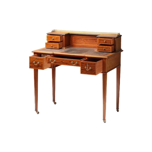 288 - An Edwardian inlaid mahogany Maple & Co, bonheur du jour of inverted breakfront form. The superstruc... 