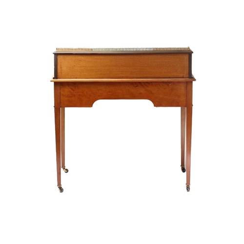 288 - An Edwardian inlaid mahogany Maple & Co, bonheur du jour of inverted breakfront form. The superstruc... 