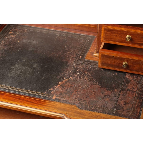 288 - An Edwardian inlaid mahogany Maple & Co, bonheur du jour of inverted breakfront form. The superstruc... 