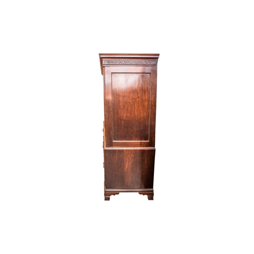 299 - A George III mahogany linen press, the two-door upper section with blind fret frieze, the figured pa... 