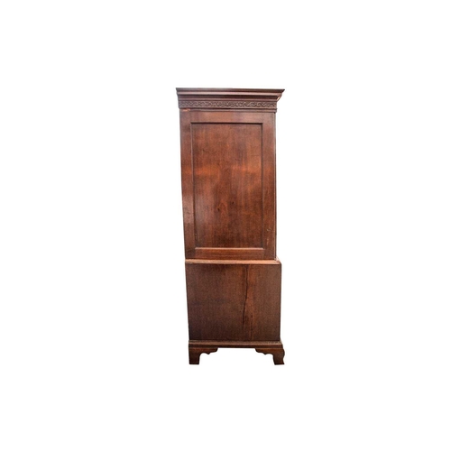 299 - A George III mahogany linen press, the two-door upper section with blind fret frieze, the figured pa... 