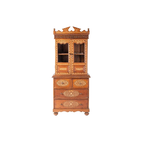 300 - An Anglo-Indian bone and ebony inlaid cabinet, early 20th century, with a shaped broken arch pedimen... 