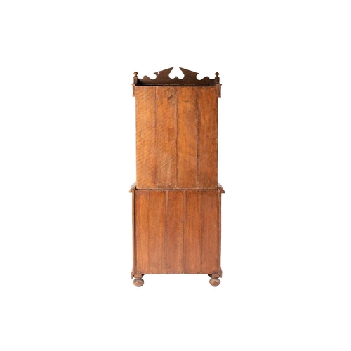 300 - An Anglo-Indian bone and ebony inlaid cabinet, early 20th century, with a shaped broken arch pedimen... 