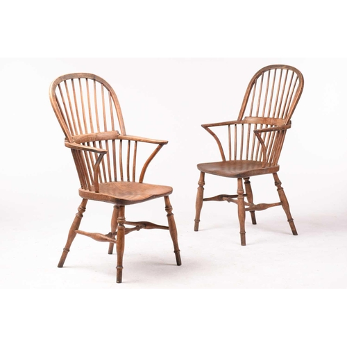 307 - A pair of 19th-century hoop-back Windsor open armchairs, with simple spindle backs and swept arms ab... 