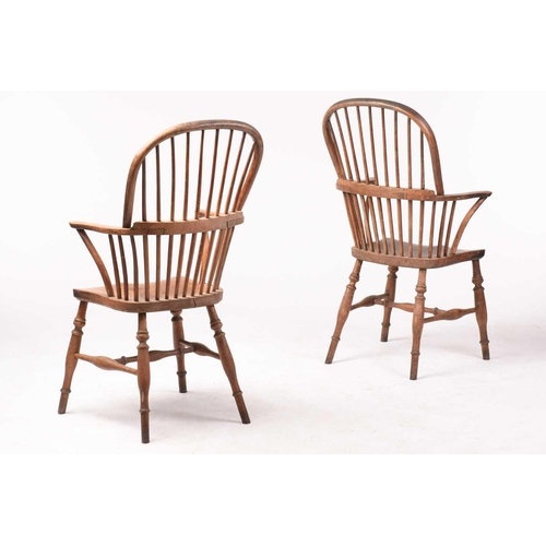 307 - A pair of 19th-century hoop-back Windsor open armchairs, with simple spindle backs and swept arms ab... 