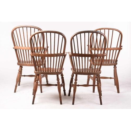 307 - A pair of 19th-century hoop-back Windsor open armchairs, with simple spindle backs and swept arms ab... 