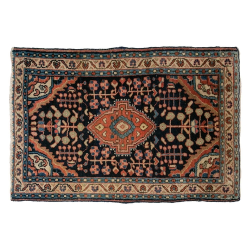 323 - An old Sarouk rug with sprays of flowers on a pink ground within multiple borders, 120 cm x 60 cm. T... 