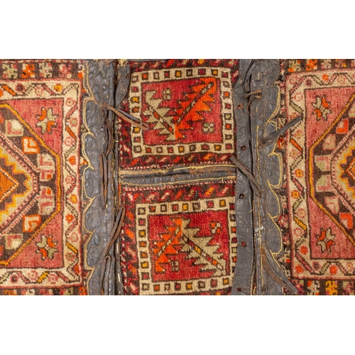 325 - An old Persian double donkey pannier bag possibly Afshar early/ mid 20th century, the two piled face... 