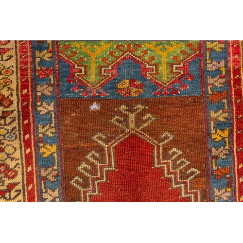 327 - An old central Anatolian prayer rug, probably from Konya, mid-20th century with an angular hooked mi... 